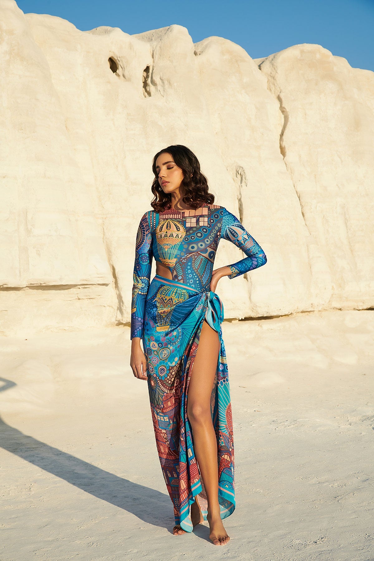Long-Sleeved Halo Swimsuit paired with Beach Bum Sarong in Cappadocia