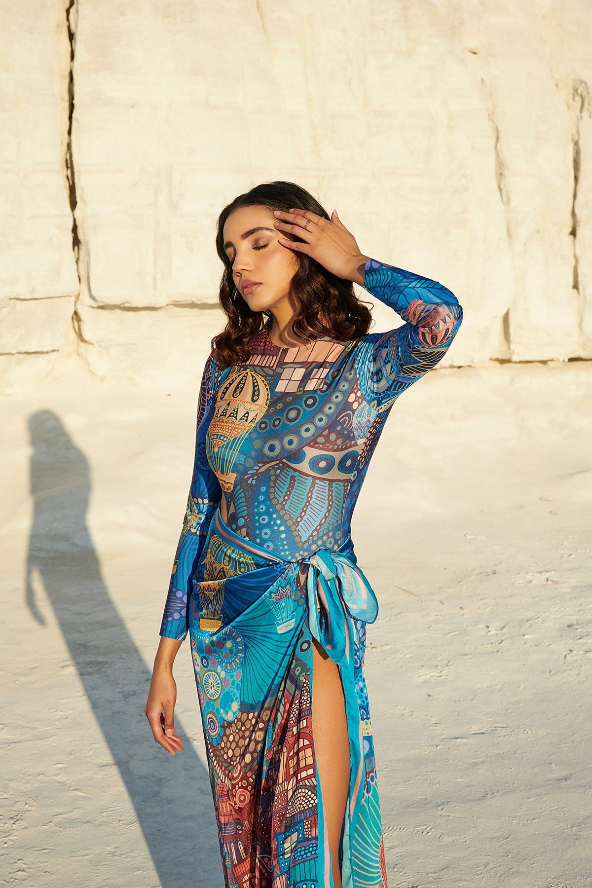 Long-Sleeved Halo Swimsuit paired with Beach Bum Sarong in Cappadocia